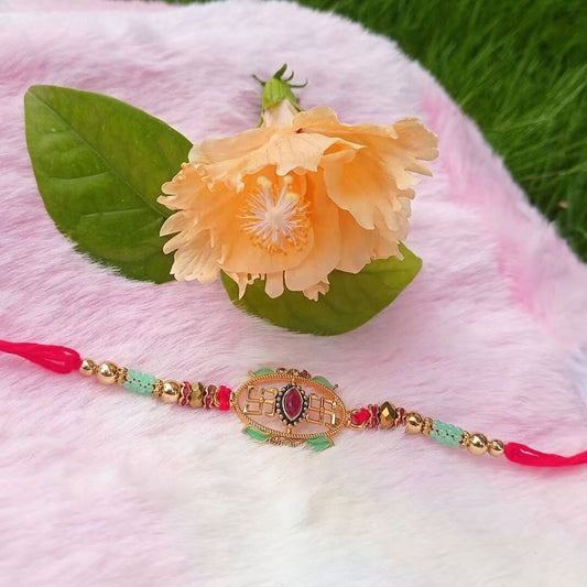 Auspicious Swastik Rakhi with Ruby Stone & Mint Green Beads | Traditional Designer Rakhi