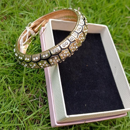 Bronze-toned hinged bracelet